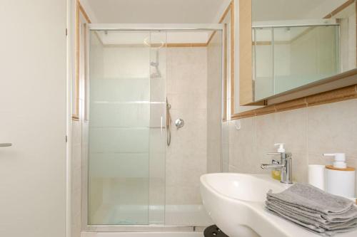 a bathroom with a sink and a shower at Le Cure in Florence