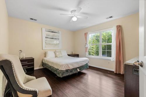 a bedroom with a bed and a window at Entire 4-BR in Beloved DC Area Takoma Park in Takoma Park