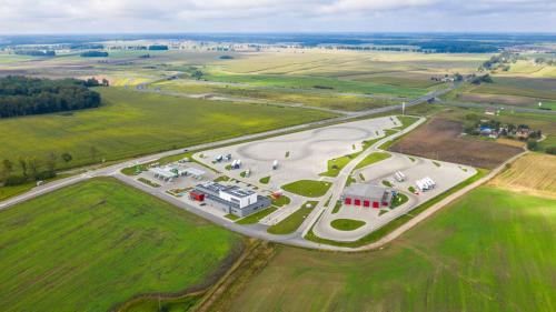 an aerial view of a parking lot in a field at Hotel Picaro Kopytkowo A1 in Kopytkowo