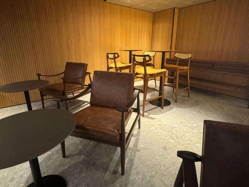 a group of chairs and tables in a room at Novotel Recife Marina in Recife
