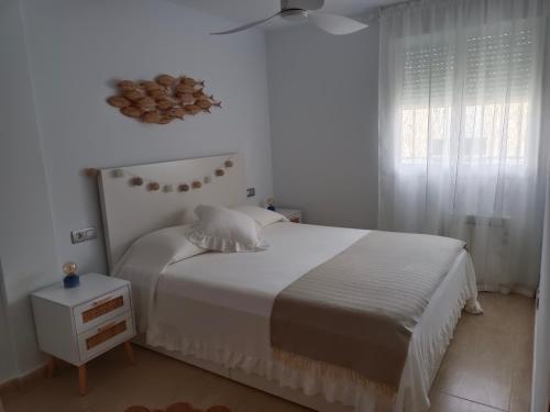 Ένα ή περισσότερα κρεβάτια σε δωμάτιο στο Ático El Racó de Carmen - Torreblanca