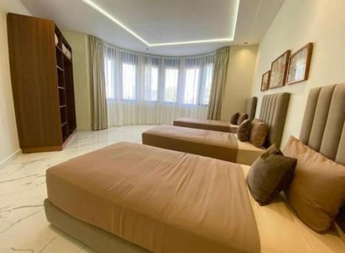 a hotel room with two beds and a window at Appartement Centre ville Tanger in Tangier