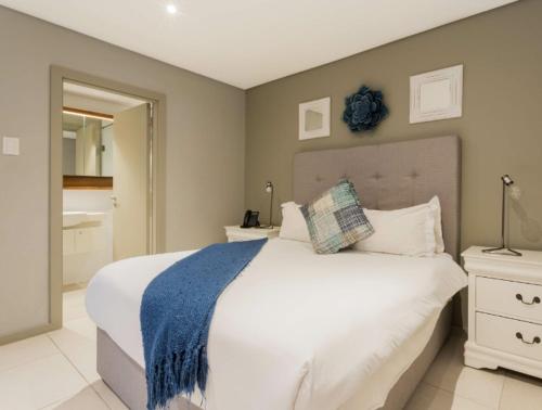 En eller flere senge i et værelse på Zimbali Suites 601