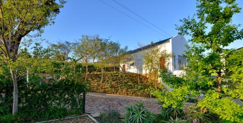 an external view of a house with a garden at Val Du Charron Wine & Leisure Estate in Wellington