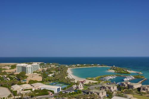an aerial view of the beach at the resort at The Ritz-Carlton, Bahrain in Manama