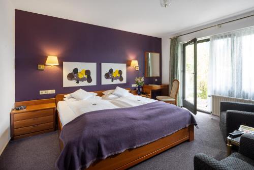 Postel nebo postele na pokoji v ubytování Parkhotel Hitzacker