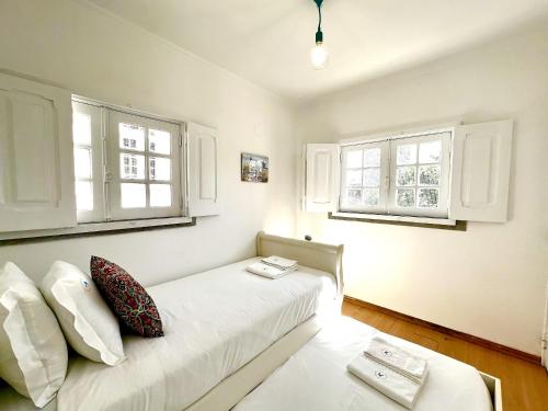 Ένα ή περισσότερα κρεβάτια σε δωμάτιο στο Estoril Beach House