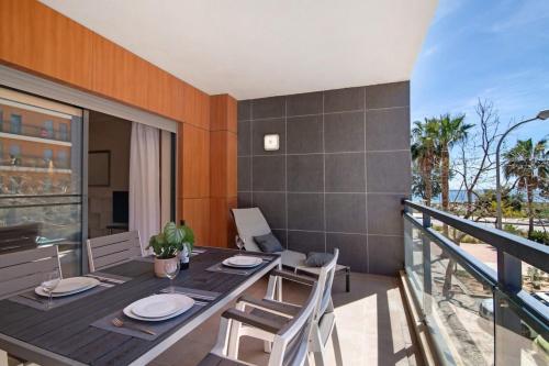 a dining room with a table and chairs on a balcony at HolidaysPT - MyOasis I - T2 Apartment in Olhão