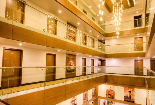 a large building with a pool in the middle at The Atrium Boutique Hotel in Mysore