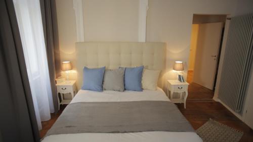 Ponterosso Suite tesisinde bir odada yatak veya yataklar