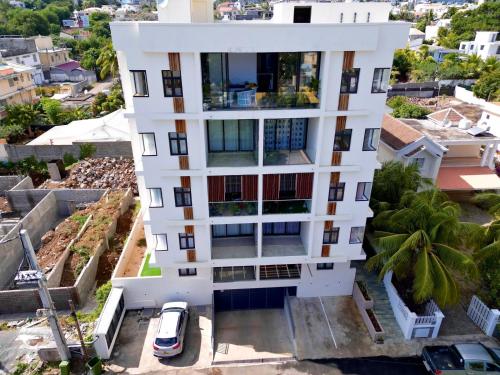 an aerial view of a white building at Cozy Seaview Penthouse in Flic-en-Flac