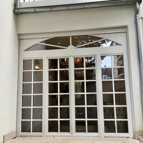 a sliding glass door on a house at Pétrusse Élite Suites in Luxembourg