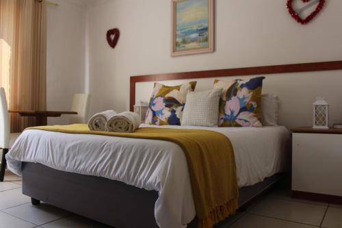 Ένα ή περισσότερα κρεβάτια σε δωμάτιο στο Jowie's Guesthouse
