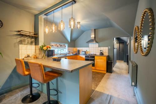 a kitchen with a large island in the middle at The Saddlers in York