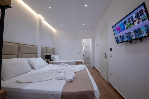 Ένα ή περισσότερα κρεβάτια σε δωμάτιο στο Erioni Hotel