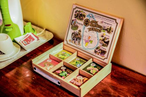 a wooden box filled with toys on a table at Casa Di Campagna In Toscana in Sovicille