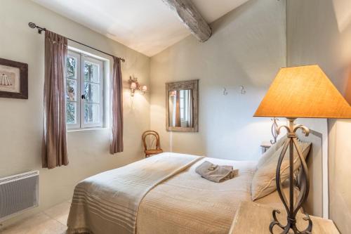 Postel nebo postele na pokoji v ubytování Au Cœur de la Pinède