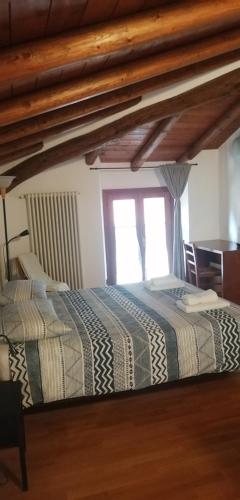 a bedroom with a bed and a window at La Casetta in Como