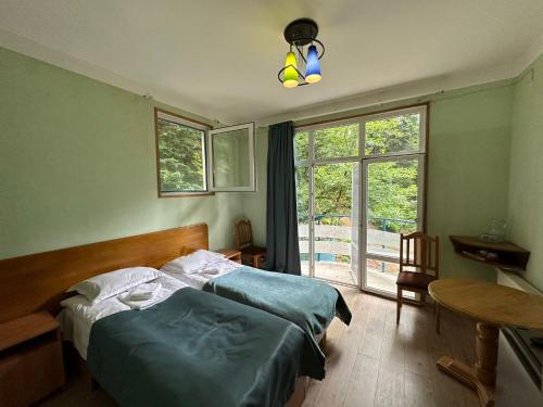 Postel nebo postele na pokoji v ubytování Nunisi Forest Hotel & SPA