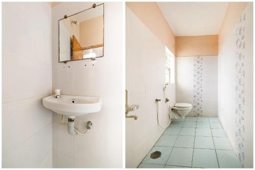 a bathroom with a sink and a toilet at Super Hotel O Rj Tower in Madurai