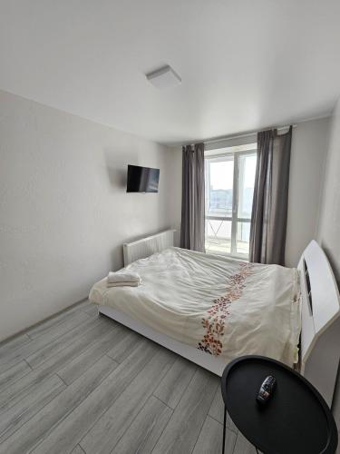 a small bedroom with a bed and a window at ЖК Яровиця in Lutsk