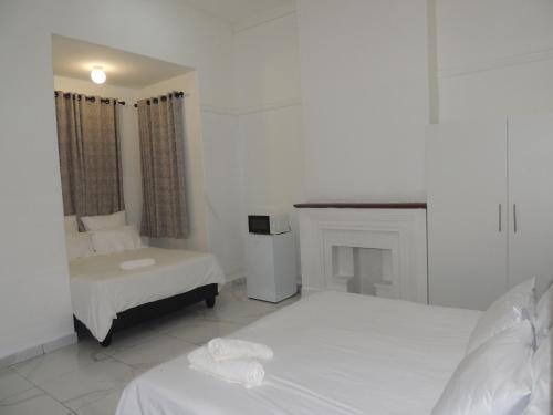 Ένα ή περισσότερα κρεβάτια σε δωμάτιο στο De Dreamz Guest House