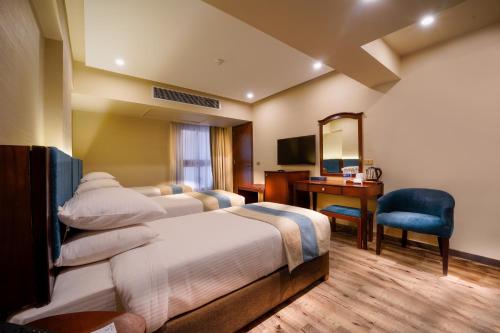 Postel nebo postele na pokoji v ubytování Stay Inn Pyramids Hotel