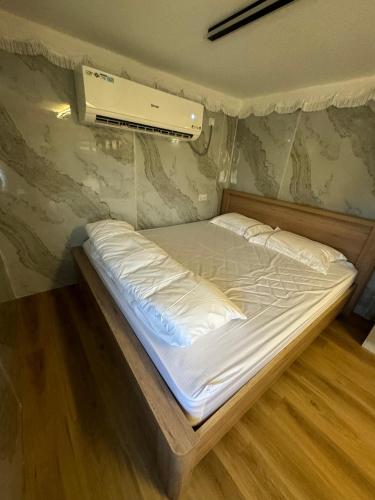 a bed in a tent in a room at The Out in Sinādil