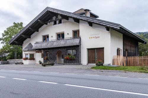 a white building on the side of a road at Appartement Egart 2 in Resia