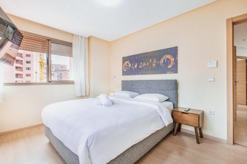 Postel nebo postele na pokoji v ubytování Migdal Gueliz Apart Hôtel