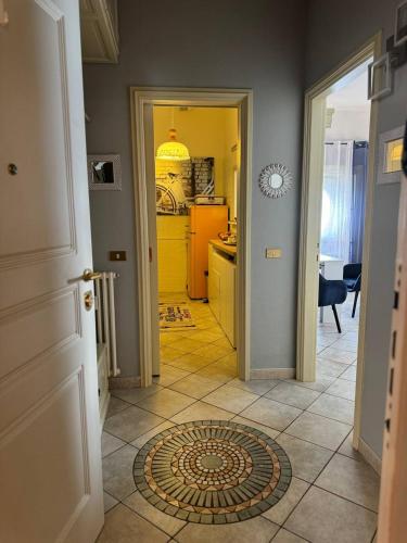 a hallway of a kitchen with a yellow refrigerator at Blue Lake View in Oggebbio