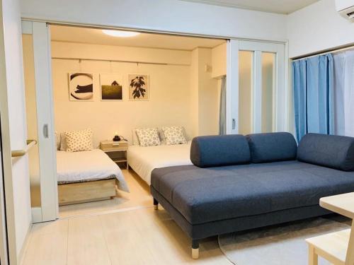 Postel nebo postele na pokoji v ubytování Shinjuku 歌舞伎町 601