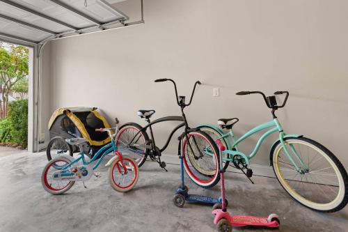 three bikes are parked next to a garage at Mariners Getaway in Saint Simon Mills