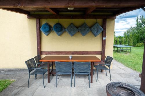 a table and chairs under a gazebo at Chalupa Měňany - Karlštejn in Beroun