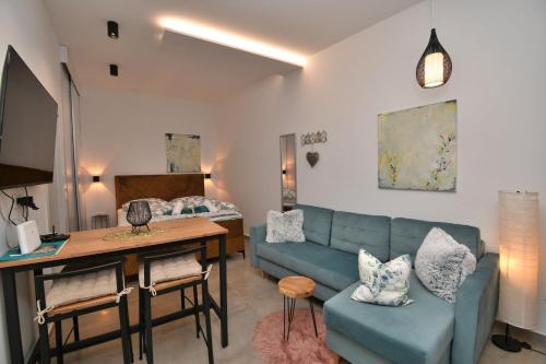 a living room with a couch and a table at Apartment Leprin in Labin