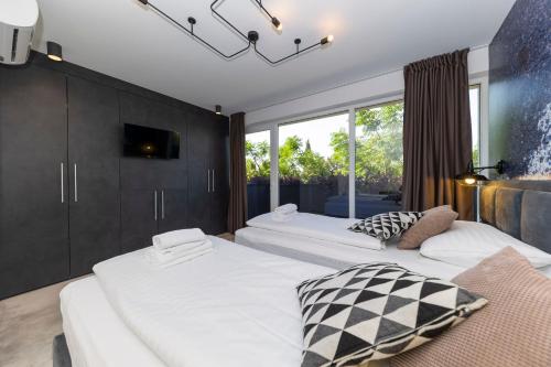 Ένα ή περισσότερα κρεβάτια σε δωμάτιο στο Villa Mendula