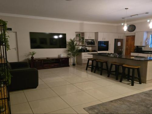 a kitchen and living room with a couch and a table at BestInn in Lorraine