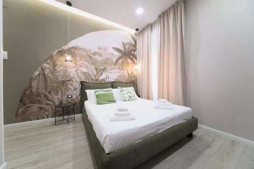 Ένα ή περισσότερα κρεβάτια σε δωμάτιο στο B&B Les Lumières