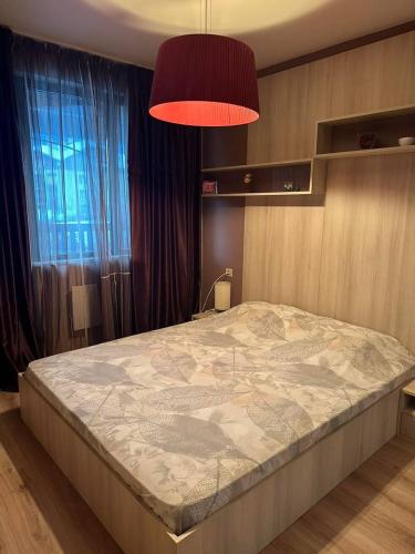 En eller flere senge i et værelse på Luxury Apartment Bansko
