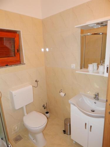 a bathroom with a toilet and a sink at Apartment Matilda in Starigrad