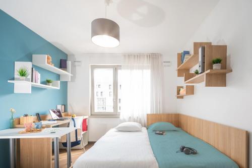 Postel nebo postele na pokoji v ubytování Nemea Appart Hotel Elypseo Strasbourg Port