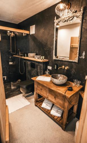 a bathroom with a sink and a mirror at K-Style Chalet Premium-Twin-Lofts with private Sauna in Mieders