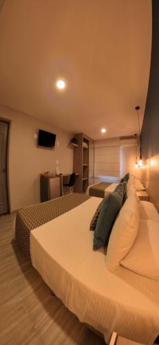 Postel nebo postele na pokoji v ubytování Hotel Quinta de Cabecera