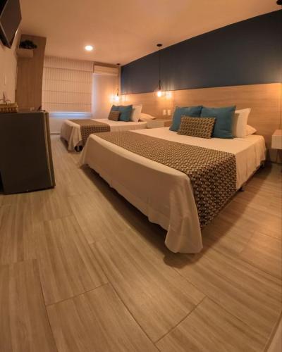 Postel nebo postele na pokoji v ubytování Hotel Quinta de Cabecera