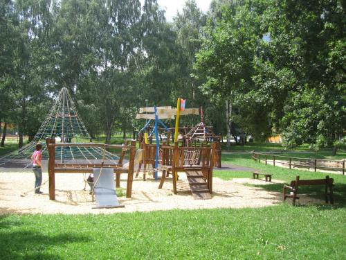 a child standing in a playground in a park at Jihoceska Pohoda in Třeboň