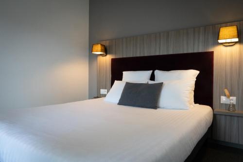 Postel nebo postele na pokoji v ubytování Nemea Appart Hotel Elypseo Strasbourg Port