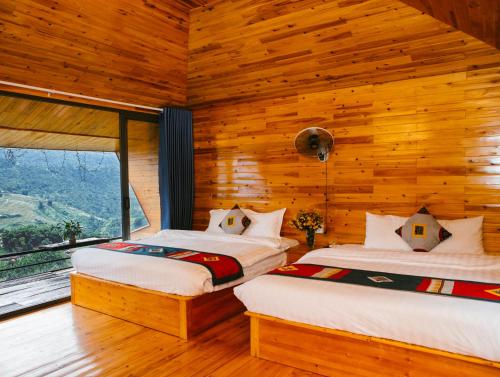 Postel nebo postele na pokoji v ubytování H'Mong Cát Cát Homestay