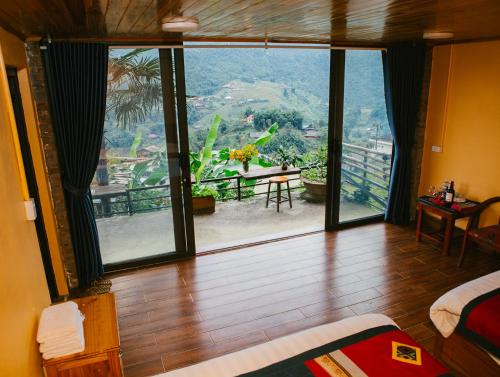Postel nebo postele na pokoji v ubytování H'Mong Cát Cát Homestay