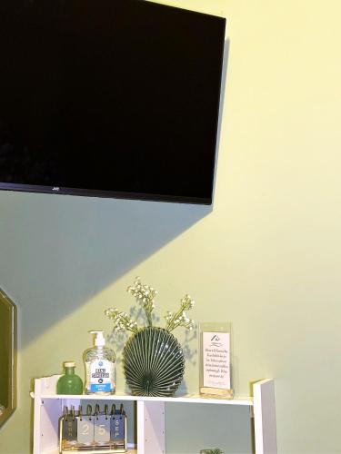 a flat screen tv on top of a shelf at The Rosemary Stay in Hull
