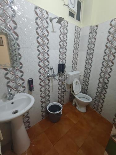 a bathroom with a sink and a toilet at Mild Life Hostel Rishikesh in Rishīkesh